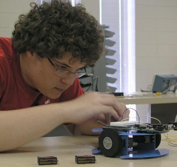 LeJeune working on a robot.